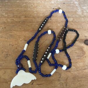 Whale tail necklace with blue beads . Approximately 17 inches long
